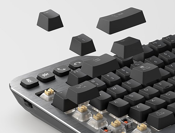 Key caps of mechanical keyboard floating away to show Kaihl Silent Tactile switches on Silent Mechanical Keyboard.