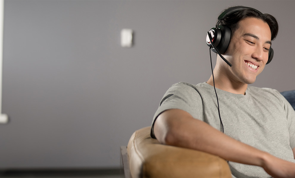 Man having a video conference wearing his H2000 headsets.