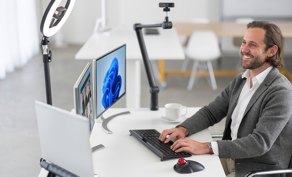 Man using Kensington products at desk