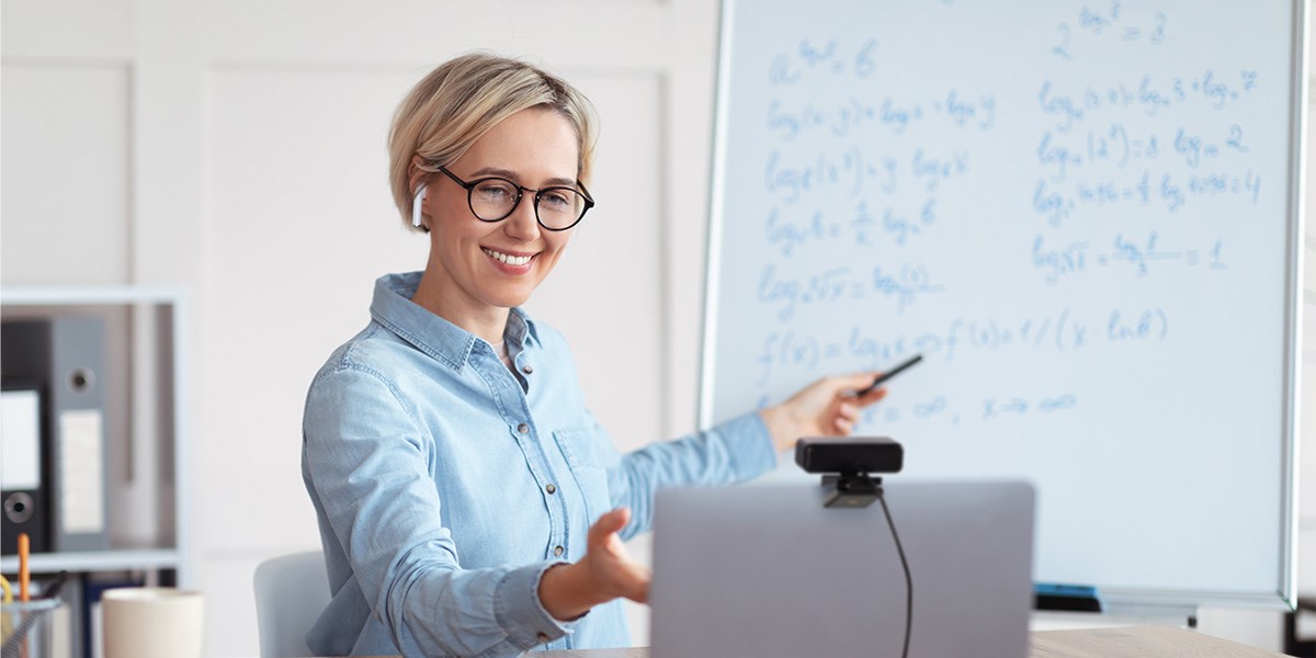 Woman presenting while looking at Kensington webcam